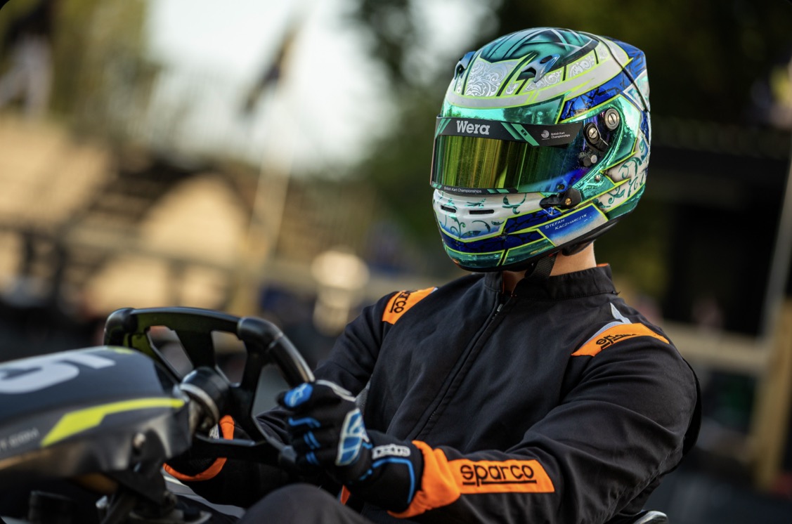 Racing driver wearing a custom SK Designs painted helmet